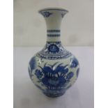A Chinese Qianlong blue and white baluster vase decorated with birds, flowers and leaves