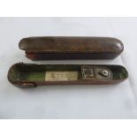 An Oriental 19th century rounded rectangular lacquered pen case with brass inkwell
