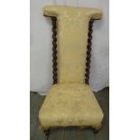A Victorian upholstered prie-dieu with barley twist sides on turned legs