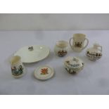 Six Goss crested porcelain pieces to include a tyg, a covered dish and a jug