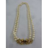 A double row cultured pearl necklace with 18ct yellow gold and diamond leaf encrusted clasp