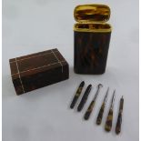 A tortoiseshell rectangular snuff box, a faux tortoiseshell cigarette box with six other items