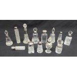 A quantity of cut glass and scent bottles of various shapes and forms all with silver collars (13)