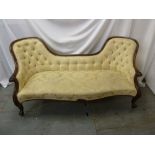A Victorian mahogany upholstered settle on cabriole legs