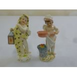 Meissen two figurines of putti, one holding a lantern, the other cooking food