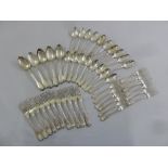 A quantity of antique silver flatware mixed patterns to include table spoons and table forks, approx