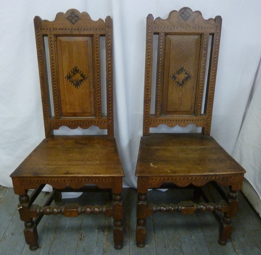 A pair of oak hall chairs on turned legs