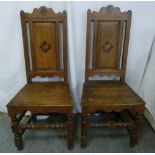A pair of oak hall chairs on turned legs