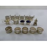 A quantity of silver to include condiments, napkin rings and tea glass holders (18)