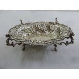 A late Victorian silver bonbon basket, shaped oval, pierced sides on four scroll supports, London