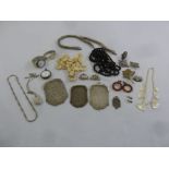 A quantity of costume jewellery to include necklaces, earrings, brooches, watches and purses