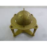 A brass table mounted globe on stand
