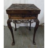 Chinese hardwood envelope card table, heavily carved with dragons and peonies (to include original