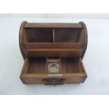 An Edwardian desk top stationery box of cylindrical form with brass mounts and key