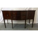 A Regency style mahogany sideboard with two drawers flanked on either side by two cupboards on