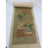 A Chinese scroll painting on silk of flowers in a baluster vase