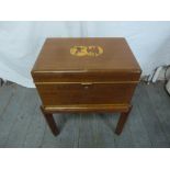 An early 20th century rectangular mahogany work box on stand, the hinged cover inlaid with satinwood