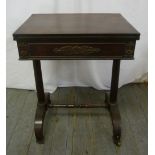 A Victorian mahogany rectangular card table on scrolling supports with original castors