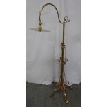 Art Nouveau style brass and copper telescopic standard lamp on three scroll supports
