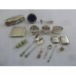 A quantity of silver and white metal to include a compact, vesta cases, tongs, a covered box and