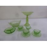 A quantity of Art Deco style green glass to include cups and saucers, a tazza and a fruit bowl (10)