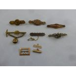 Six Edwardian brooches of various shape and form (some gold) and a 9ct gold clasp