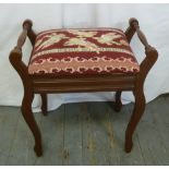 A mahogany rectangular piano stool with hinged upholstered seat