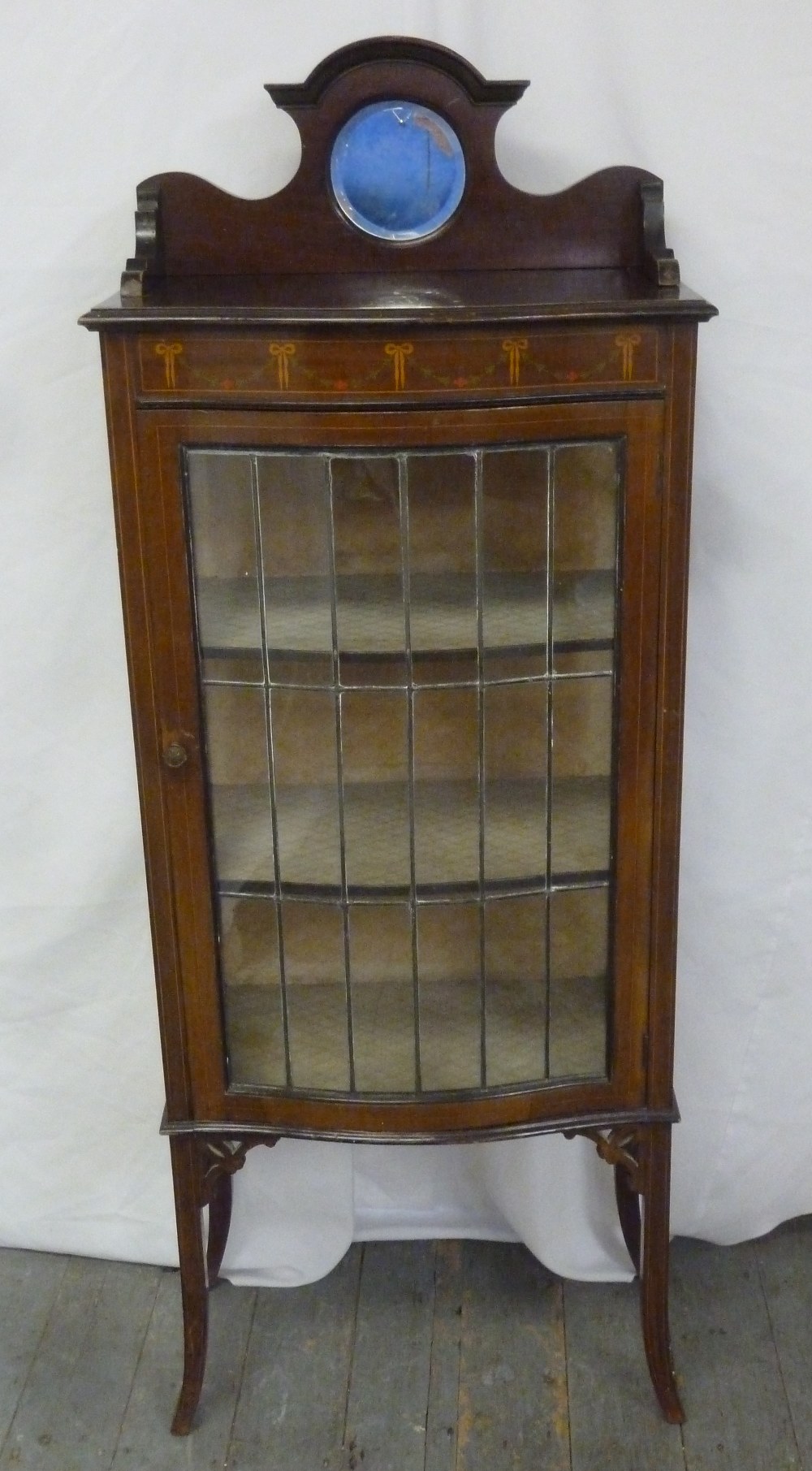 An Edwardian mahogany rectangular glazed display case on four tapering rectangular legs with