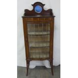 An Edwardian mahogany rectangular glazed display case on four tapering rectangular legs with