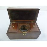 An Edwardian mahogany rectangular tea caddy with two compartments and glass mixing bowl and brass