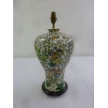 An Oriental famile verte baluster form table lamp