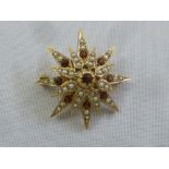 Garnet, seed pearl and gold star brooch, approx total weight 7.3g