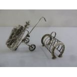 A silver plated cocktail set in the form of a golf bag trolley and silver plated Horseshoe toast