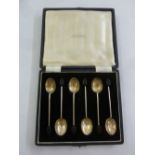 A cased set of silver coffee spoons with coffee bean terminals by Mappin and Webb