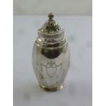 A silver sugar sifter, compressed ovoid form with pierced pull off cover, London 1909 by the