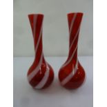 A pair of red and white glass vases circa 1960