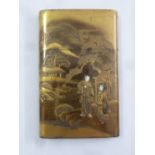 A Chinese gilded card case with pull off cover decorated with figures in a stylised landscape