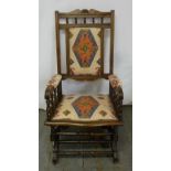 An early 20th century mahogany upholstered rocking chair