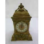 A French brass mantle clock, rectangular, enamel chapter ring, Arabic numerals surmounted by urn