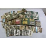 A quantity of antique postcards, photographs and ephemera to include albums, sets and loose