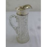 A cut glass claret jug with silver collar, Birmingham 1914