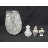 A quantity of glass to include a cut glass vase and three scent bottles with drop stoppers