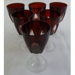 A set of six overlaid cranberry wine glasses