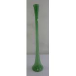 A 20th century green art glass long stem vase