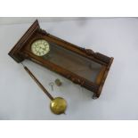 A mahogany cased wall regulator with glazed front and enamel dial to include pendulum, key and