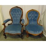 A Victorian upholstered mahogany armchair and a matching ladies chair