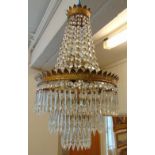 A gilt metal and cut glass bag chandelier of customary form