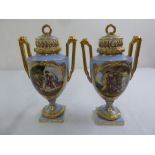 A pair of Vienna hand painted baluster vases with angled gilded handles and raised pull off