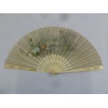 An early 20th century decorative silk fan