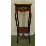 A rectangular marble top mahogany plant stand with applied gilded metal mounts on four cabriole